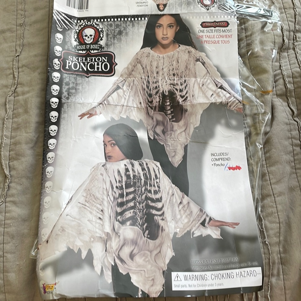Skeleton poncho excellent preowned condition, one size fits most